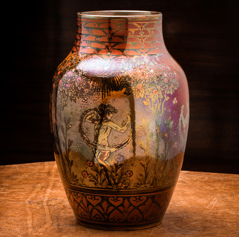 asian style decorated vase on lone stool